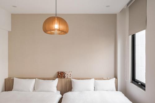 Ein Bett oder Betten in einem Zimmer der Unterkunft Yan Chen Inn