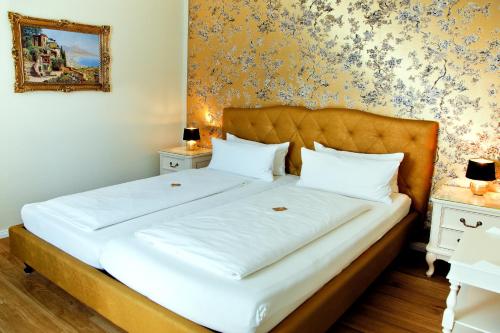 Postel nebo postele na pokoji v ubytování Hotel Kronprinz