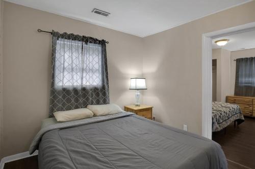 a bedroom with a large bed with a window at Small 2br East Knox apartment Pet friendly in Knoxville