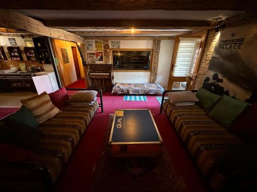 a living room with a couch and a table at Fontaine Mansion in Liepāja