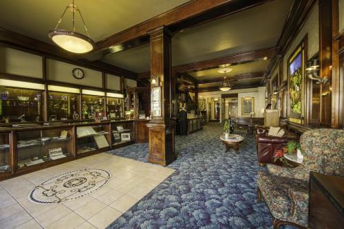 a living room with a couch and a table at Historic Cary House Hotel in Placerville