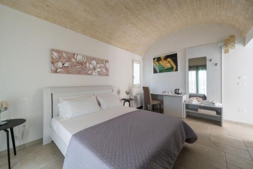 Giường trong phòng chung tại B&B Villa Vittoria Ostuni