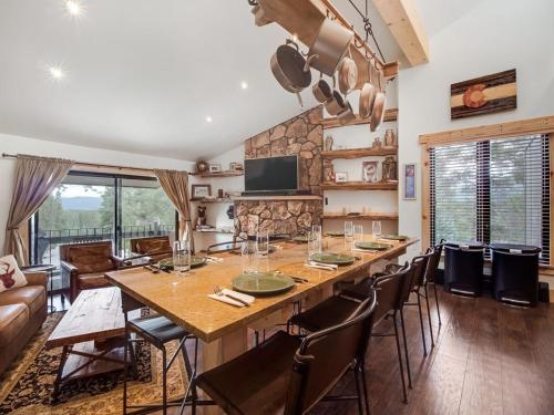 a dining room with a large wooden table and chairs at Cozy 2BR Condo Near Peak 8 and Town with Hot Tub Access in Breckenridge