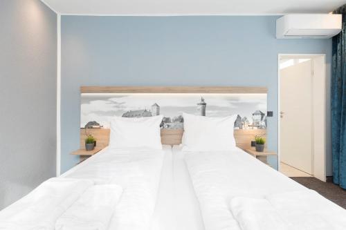 Aparthotel by dasPaulにあるベッド