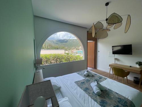 Postel nebo postele na pokoji v ubytování Hôtel Astria