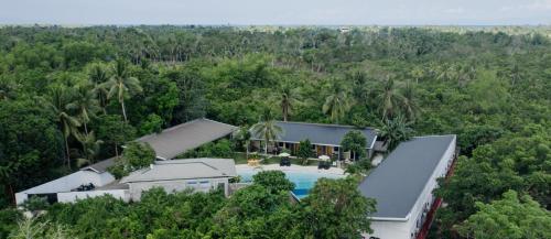 an aerial view of a house with a swimming pool at Hidden Lagoon Resort in Panglao