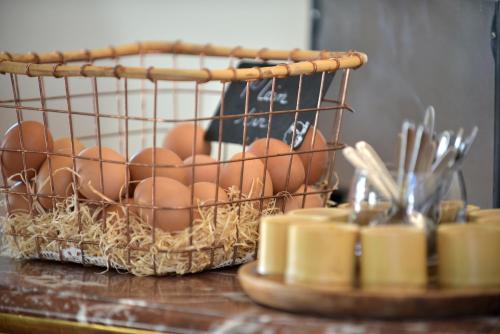 a basket of eggs sitting on a table at Ostella Spa & Resort in Bastia
