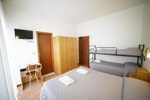 Letto o letti in una camera di Hotel Ischia