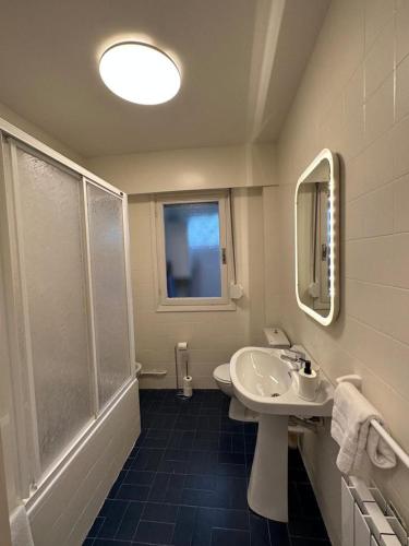 a bathroom with a sink and a shower at SUKARRIETA Urdaibai in Pedernales