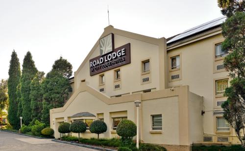 a hotel building with a sign on top of it at Road Lodge JNB Airport in Johannesburg