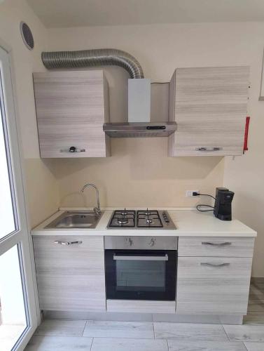 Η κουζίνα ή μικρή κουζίνα στο Civico 14 Apartment 2