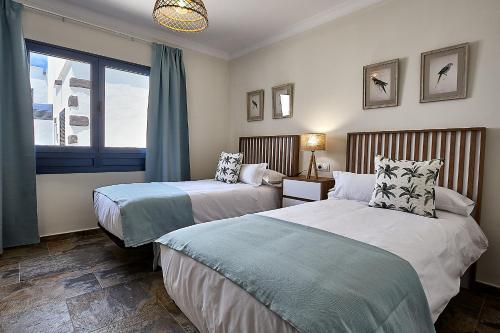 Postel nebo postele na pokoji v ubytování CASA 7 SOLES