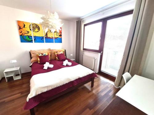 a bedroom with a bed with two stuffed animals on it at Entire Apartment, near Clarion, O2 Arena, Metro 3 min, Easter market in City Center 15 min in Prague