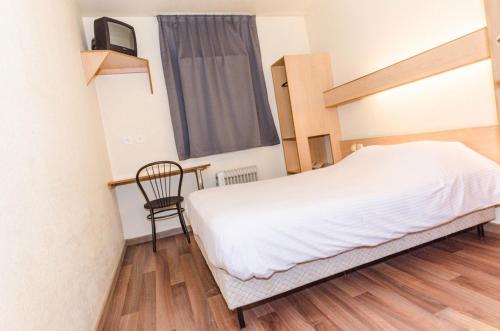 Un ou plusieurs lits dans un hébergement de l'établissement Hotel De La Basse Sambre