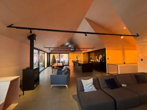 a living room with a couch and a table at Cabine A in Petite-Rivière-Saint-François