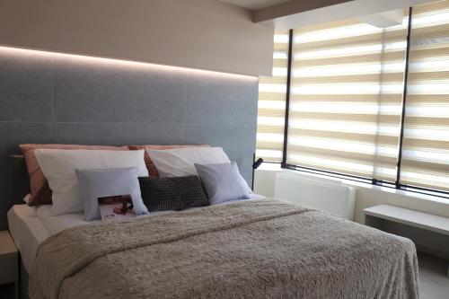 Ένα ή περισσότερα κρεβάτια σε δωμάτιο στο The Dome Aparthotel