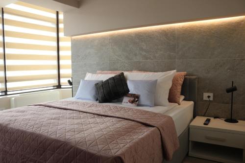 Ένα ή περισσότερα κρεβάτια σε δωμάτιο στο The Dome Aparthotel