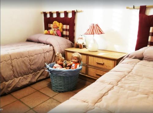 Ліжко або ліжка в номері Villetta ideale per famiglie, a pochi metri dal mare