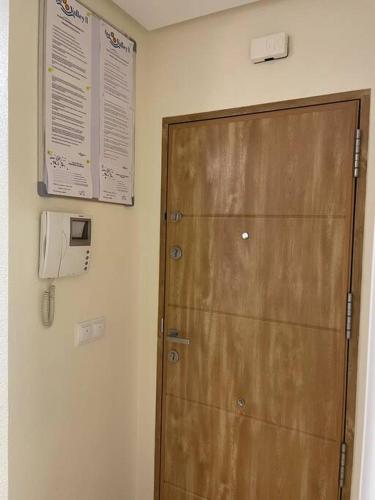 a wooden door in a room with a wall at NATUR Spa in Villanueva de Río Segura