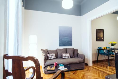 a living room with a couch and a table at we saw athens in Athens