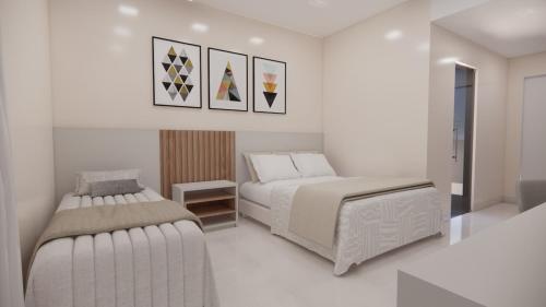 a bedroom with two beds and a couch at SPAZZIO DiROMA HOTEL COM ACESSO AO ACQUA PARK in Caldas Novas