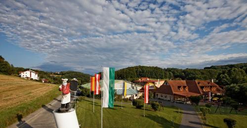 a view of a town with a statue in the grass at Vitalhotel Krainz in Loipersdorf bei Fürstenfeld