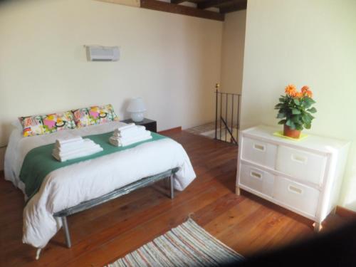 A bed or beds in a room at Locanda Corte Dè Guasconi