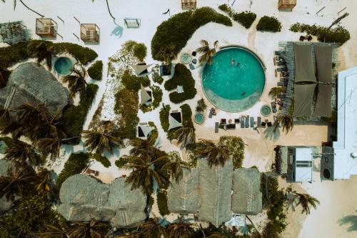 an aerial view of a resort with a swimming pool at Maya Tulum By G Hotels in Tulum