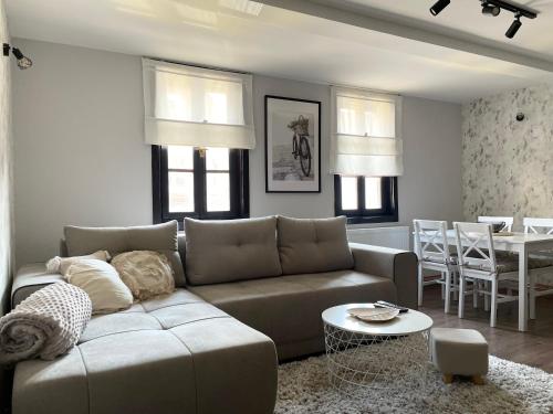 a living room with a couch and a table at Stari grad 1 in Valjevo