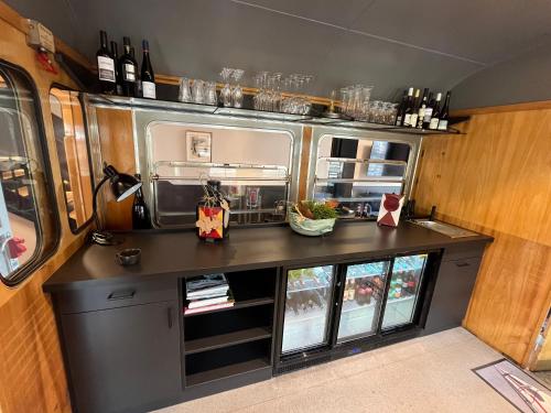 a small kitchen in an rv with a counter at Ferienbahnhof Reichenbach in Dahn