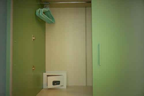 a room with a wall with a microwave in it at Countryhouse Verso in Rovereto