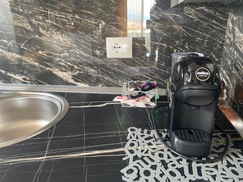 a hair dryer sitting on a counter in a bathroom at Best Apartment in Pogradec