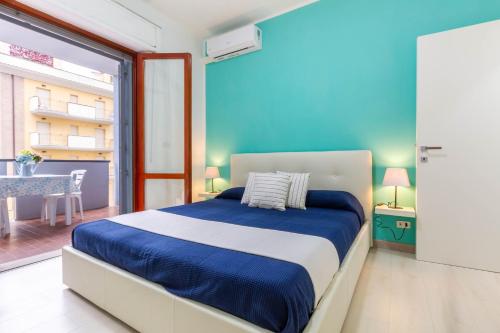 En eller flere senge i et værelse på Appartamento Turchese - MyHo Casa