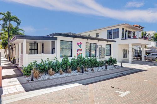 a white house with plants in front of it at Hollywood Apartments Host by BeeNomad in Hollywood