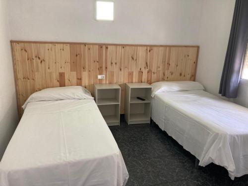 Postel nebo postele na pokoji v ubytování Malvarrosa Beach Rooms