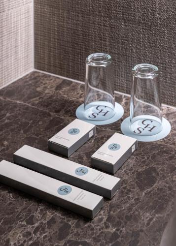 two empty wine glasses sitting on top of a counter at Crona SPA Karpaty in Skhidnitsa