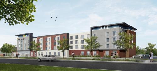 an artist rendering of a proposed apartment complex on a street at Hyatt House Sacramento Airport - Natomas in Sacramento