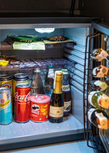 a refrigerator filled with lots of food and drinks at Crona SPA Karpaty in Skhidnitsa