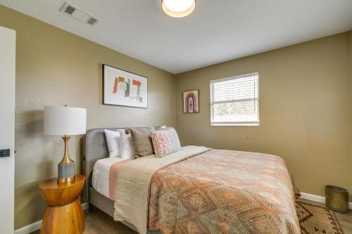 a bedroom with a bed and a lamp and a window at Florida Vacation Rental with Enclosed Porch! in Beverly Hills