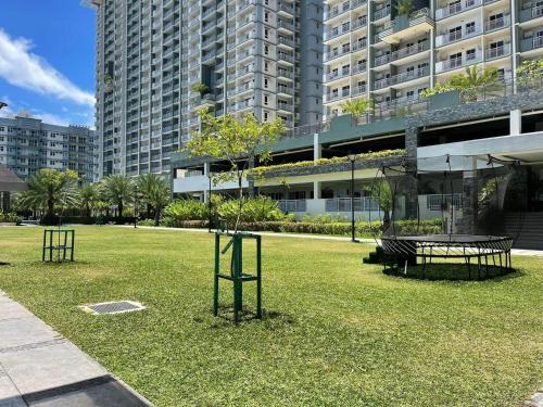 a park in front of a large building at Verdon Parc Condo 1 Bedroom in Davao City