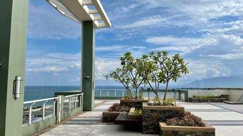 a balcony with a view of the ocean at Verdon Parc Condo 1 Bedroom in Davao City