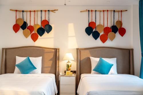 Roma Hotel Phu Quoc - Free Airport Shuttle & Sunset Town Tourにあるベッド