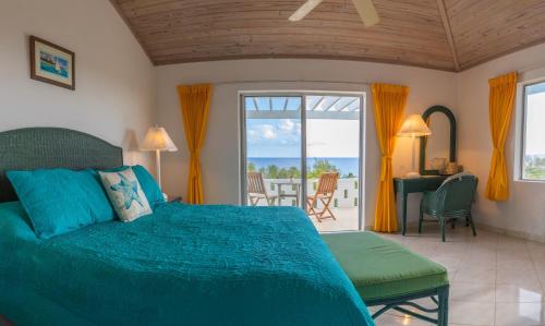a bedroom with a bed and a view of the ocean at Stella Maris Resort Club in Stella Maris