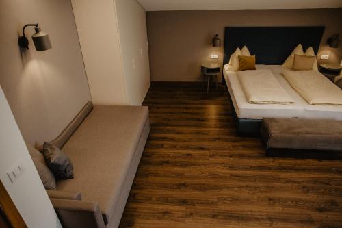 a bedroom with two beds and a cat laying on the floor at Feldgärtenhof in Silandro