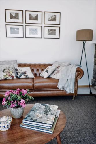 a living room with a couch and a coffee table at Casa do Santo - Wine & Tourism in Provesende