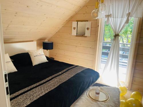 Postel nebo postele na pokoji v ubytování Woodhouse Resort