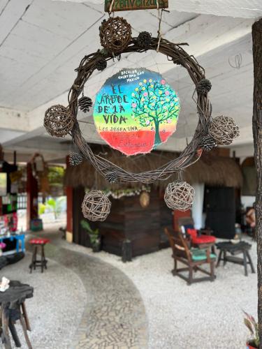 a wreath hanging from the ceiling of a store at El árbol de la vida Hostel - Private Rooms Near Bacalar Lagoon in Bacalar