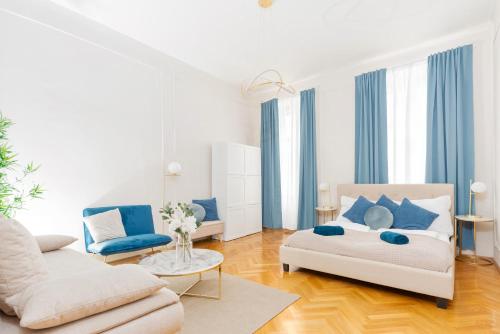 a living room with a bed and a couch at Spacious and Near Metro, Perfect for Groups of 14 in Vienna