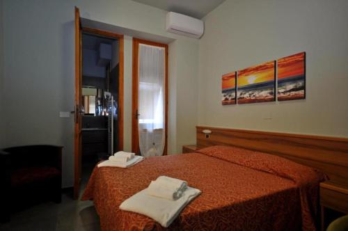 Ένα ή περισσότερα κρεβάτια σε δωμάτιο στο Residence Paradiso Bilocale 103
