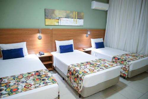 Postel nebo postele na pokoji v ubytování Comfort Hotel Bauru